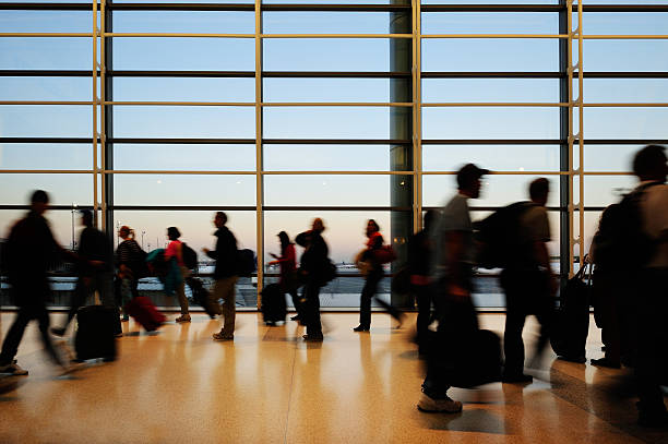 istock Modern airport terminal, travellers in silhouette 186838024