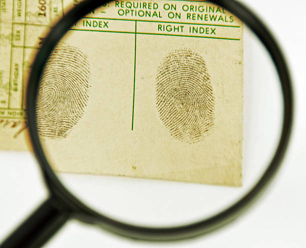 istock Fingerprints and Magnifying Glass 186838226