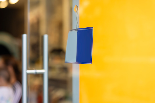 Entrance to a shop with a card-acceptance sign