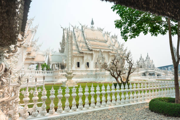 istock Within the grounds and multiple structures of Wat Rong Khun,fantastical White Temple,Chiang Rai,Northern Thailand. 1868384086