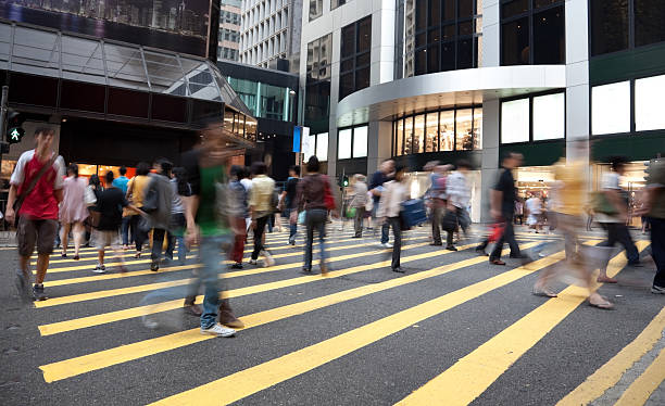 istock Busy crosswalk in Hong Kong with motion blurred pedestrian 186838520