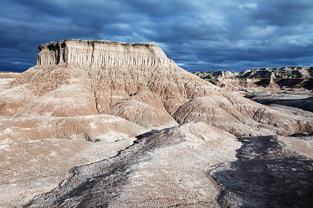 istock Badlands Landscape with Mesa and Stormy Sky 186839139