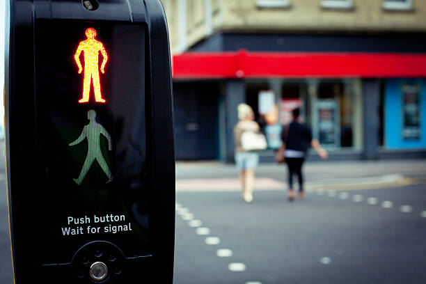 istock Pedastrian crossing the road 186839357