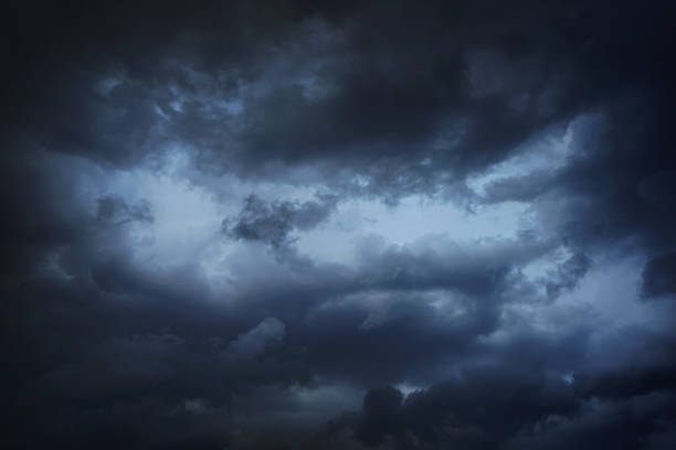 istock Black dark blue gray sky with clouds. Dramatic background. Storm hurricane wind rain cloudy. Ominous scary creepy. 1868397079