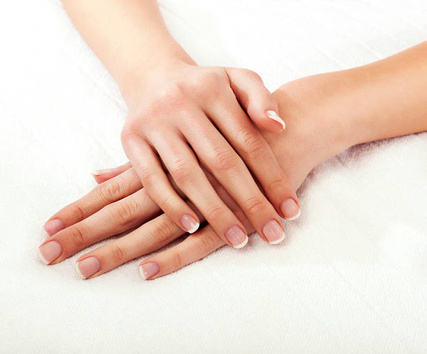 istock Close-up of a woman's hands crossed on a white background 186839814
