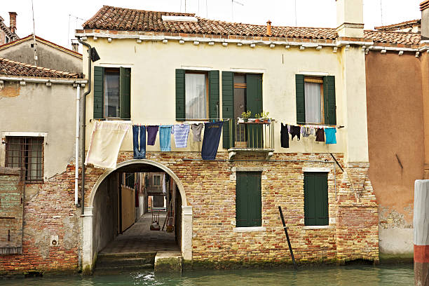 istock Houses over a Venice Canal with laundry hanging out 186840007
