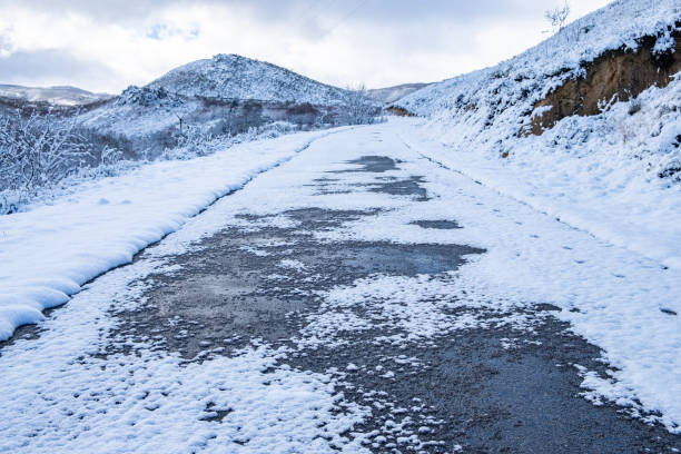 road in a mountainous area after a snowfall