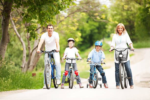 istock Happy family riding bicycle. 186840404