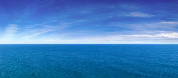Blue Ocean View Panorama 222 megapixel. A high resolution panorama of open ocean and wispy clouds. cirrus stock pictures, royalty-free photos & images