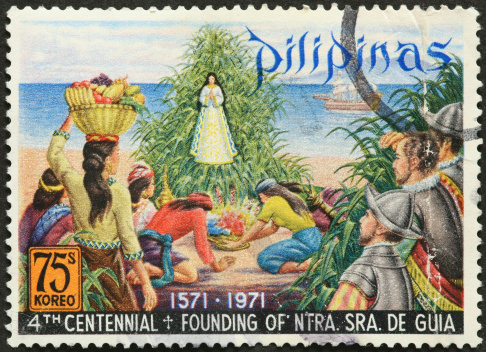 Catholic Philippines shrine and saint on an old postage stamp