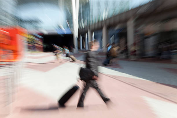 istock abstract business men with suitcase - in hurry 186841161