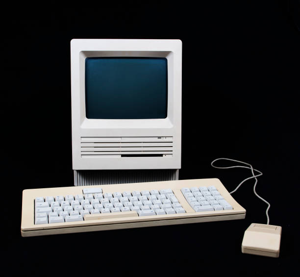 Vintage old-fashioned computer, keyboard and mouse set Shot of an old 1986 Personal Computer. computer mainframe old retro revival stock pictures, royalty-free photos & images