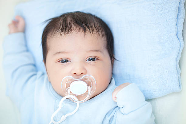 istock Portrait of adorable newborn with pacifier. 186841690