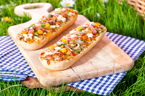 Pizza baguette appetizers with tomatoes, mozzarela and paprika