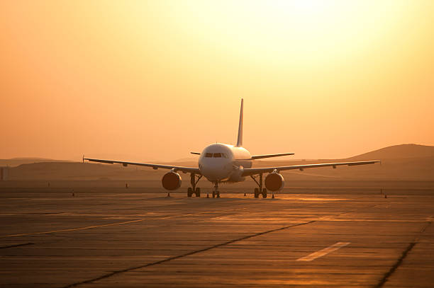 istock aircraft  and sunrise 186842637