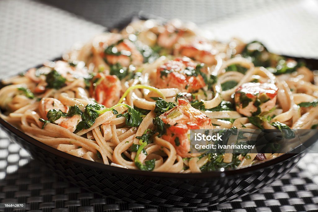 Pasta Collection - Fettuccine with salmon and spinach Fettuccine with salmon and spinach, close up Brightly Lit Stock Photo