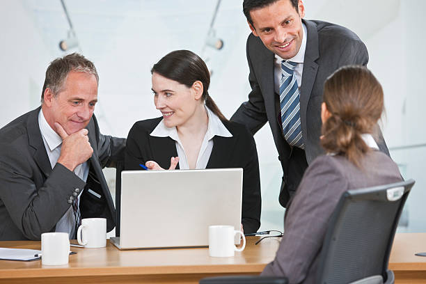 istock mixedrace business team working on laptop 186843231