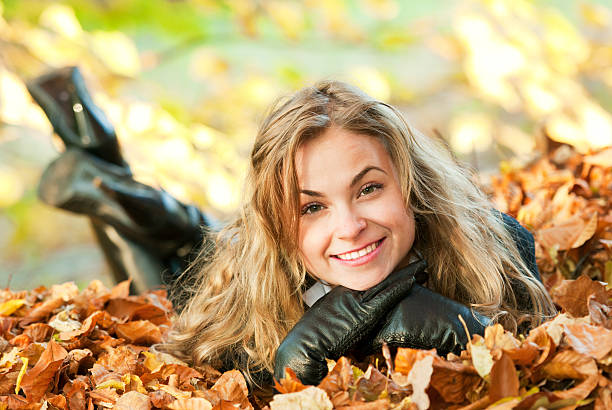 istock young woman in autumn setting 186843430