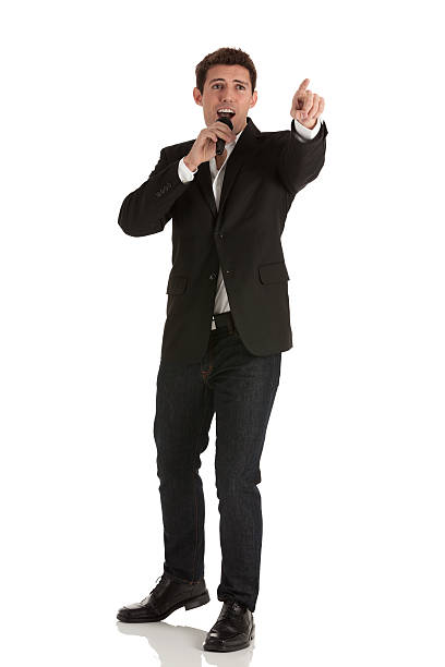 istock Businessman speaking into a microphone 186843842