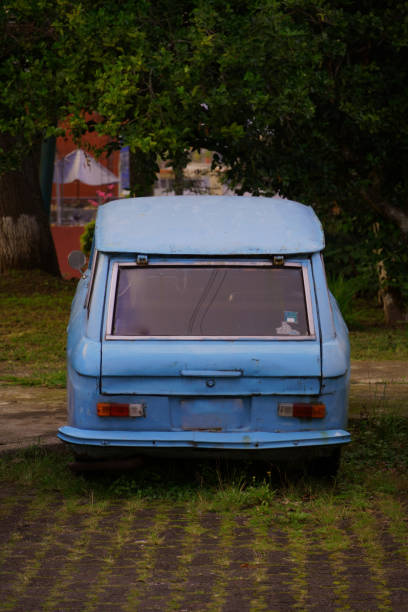 istock Abandoned vintage car in city 1868441279