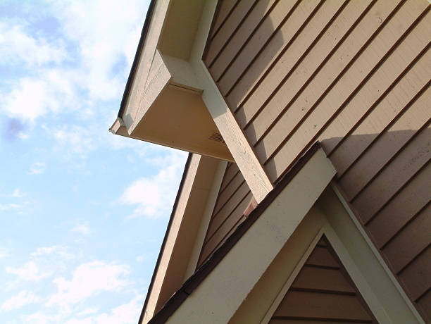 Angles, Lines, Shadows, Sky, Roof Siding House "House roof elements with cedar wood siding, blue sky and clouds.See more of my" siding stock pictures, royalty-free photos & images