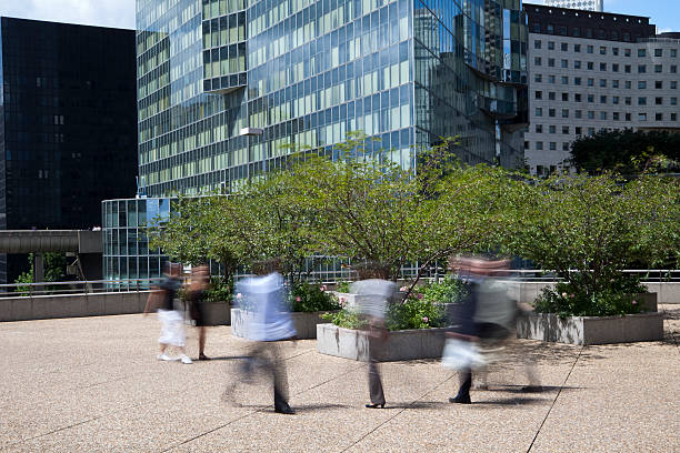 istock Business People Walking Through Financial District, Blurred Motion 186844274