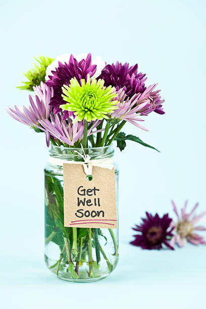 Get Well Soon Flowers in a jar with get well message. get well soon stock pictures, royalty-free photos & images