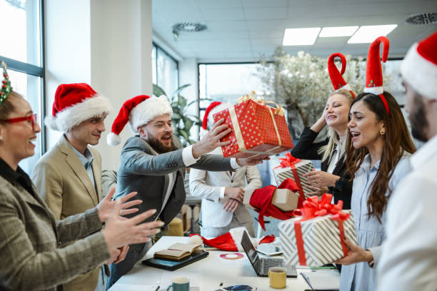 istock Gift Stacking During Office Christmas Party For Excited Female 1868443339
