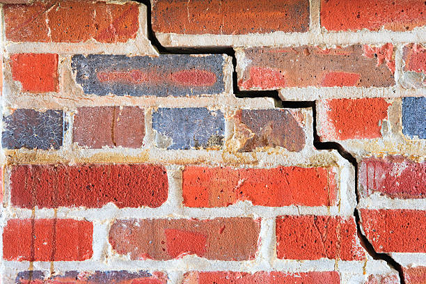 istock Grunge brick wall with crack 186844598