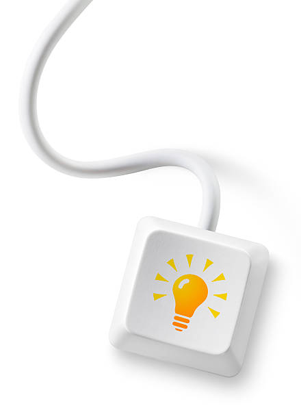 Idea. Computer key with cable Computer key with a lightbulb icon. Photography isolated on white in high resolution.  Similar photographs from my portfolio: computer key photos stock pictures, royalty-free photos & images