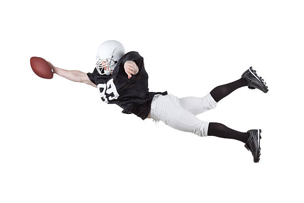 istock American football player catching a ball 186844828