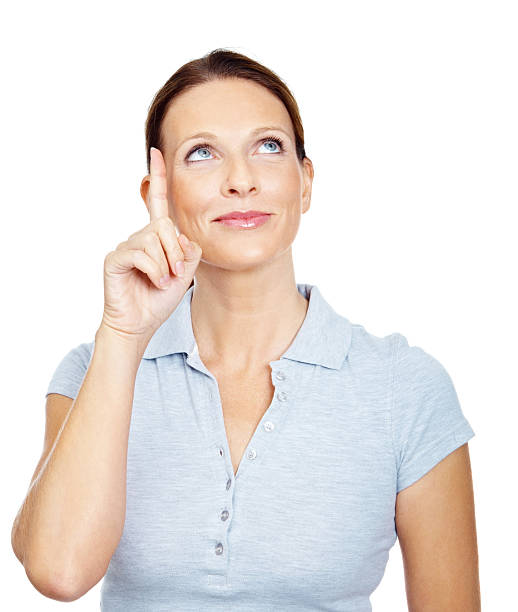 istock Smiling mature female pointing up against white background 186844902