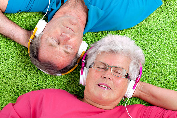 istock senior couple relaxing with music 186845671