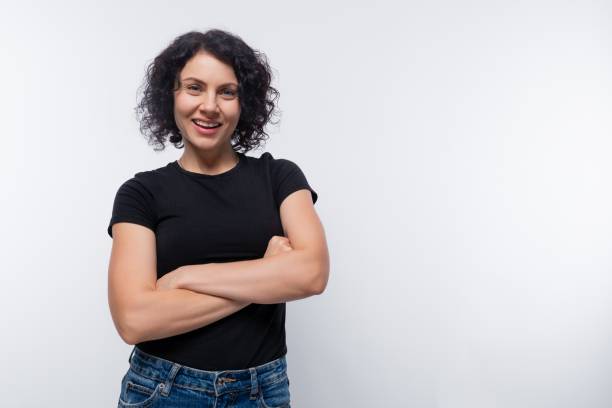istock Kind brunette woman with curly bob hairstyle on a background with copy space 1868456942