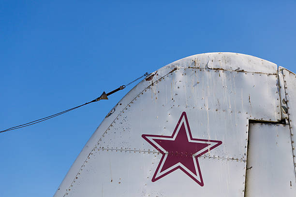 istock Old military aircraft tail against a clear blue sky 186846107
