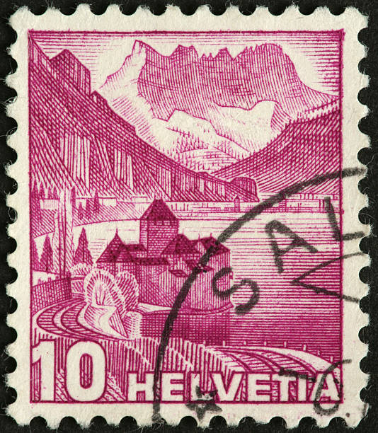 istock Alps, lake, and castle on an old Swiss postage stamp 186846605