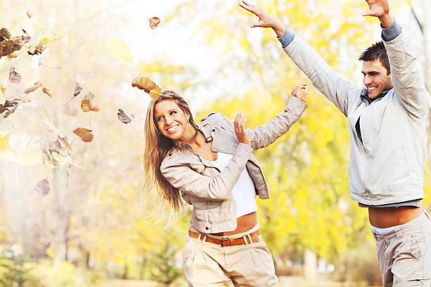 istock Beautiful smiling couple playing in the park. 186846618