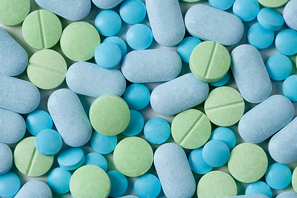 Medicine Pills Blue & Green Medicine Tables. science cure stock pictures, royalty-free photos & images