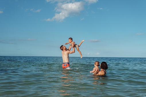 Family having fun on beach