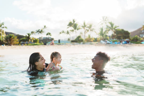 istock Loving aunty and uncle swimming with their niece 1868468433