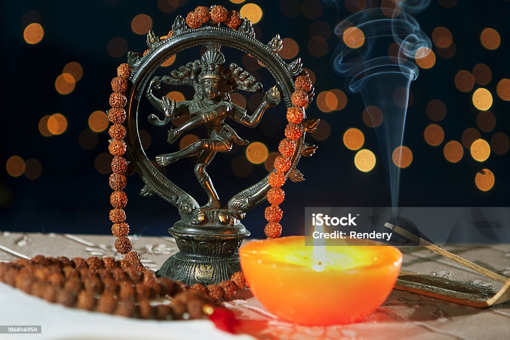 Nataraja Hinduism symbol "Nataraja figure, candle and incense stick  in mystic light" Bead Stock Photo