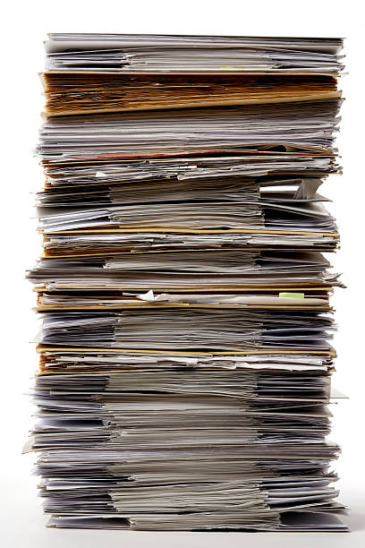 istock Isolated shot of stacked file folders on white background 186847139