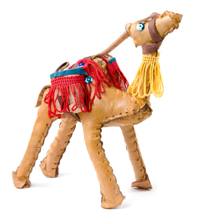 Isolated toy camel souvenir made of leather.