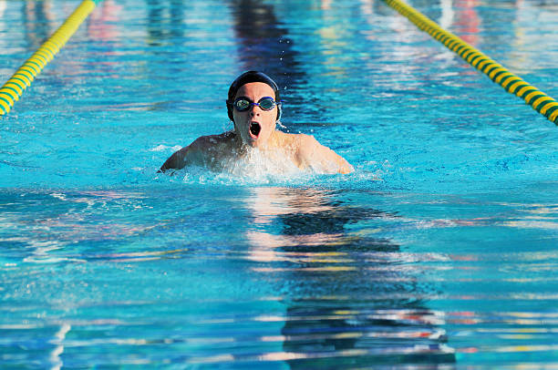 istock Intense Competitive Young Male Butterfly Stroke Swimmer During Race 186847710