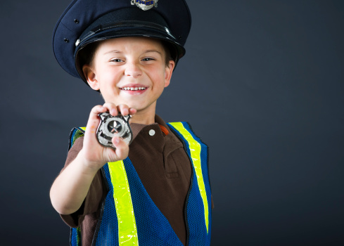 Six year old boy pretending to be a Police Officer.