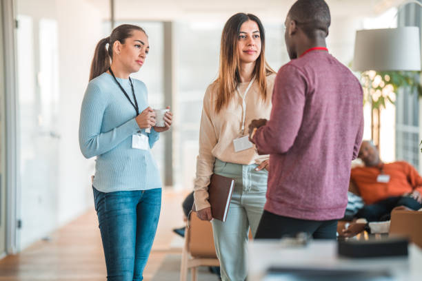 istock International Professionals Bonding Over Coffee 1868480390