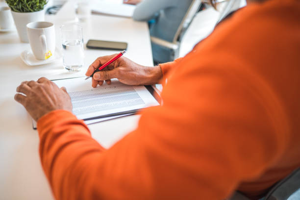 istock Hispanic Male Taking Notes During A Business Meeting 1868480403