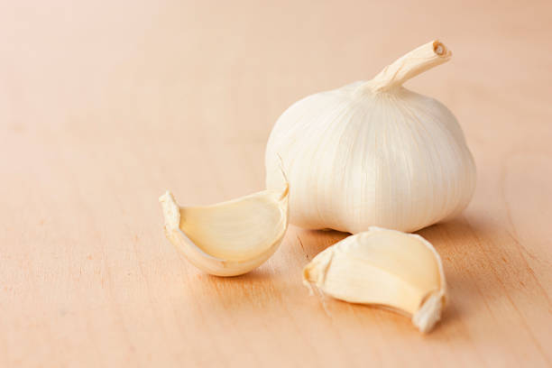 garlic head with two cloves stock photo