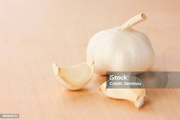 Garlic Head With Two Cloves Stock Photo - Download Image Now - Color Image, Concepts, Food and Drink