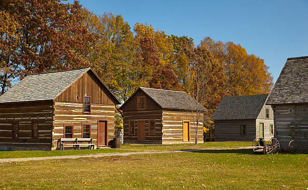 Rustic Village of Cabins With Autumn Trees